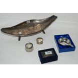 A lot comprising a boat shaped dish, silver decanter labels, napkin ring, wine taster etc
