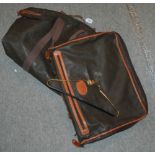 A large holdall and suit carrier stamped Mulberry Condition Report: Available upon request