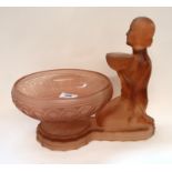 A pink pressed glass centrepiece of a kneeling woman Condition Report: Available upon request