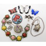 A collection of enamelled items in silver and base metal to include, butterflies, and a detailed