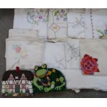 Assorted embroidered and other table linen and two tea cosies Condition Report: Available upon