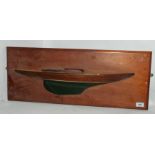 A half hull model on hard wood plaque 63cm wide Condition Report: Available upon request