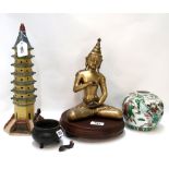 A Tibetan bronze buddha, a bronze cauldron, a pottery ginger jar and a pottery model of a