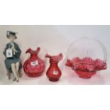 A Lladro figure of a girl in a university gown and mortar board, two cranberry glass jugs and a
