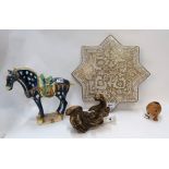 A giltwood kylin, a Islamic star tile, a pottery grotesque brush washer and a tang style horse