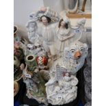 Assorted Staffordshire flatbacks, wally dugs and a continental candelabra base Provenance - The