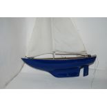 A model pond yacht, 61cm wide and resign angel, 40cm high and modern chicken (3) Provenance - The