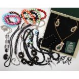A string of onyx beads with a 9ct clasp, statement necklaces and other items Condition Report: Not