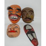 Four various oriental masks and cased bead arithmetic set Condition Report: Available upon request