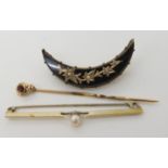 A yellow metal garnet set pin, a yellow metal pearl set pin and a mourning brooch Condition