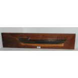 A half hull model on hardwood plaque, 67cm wide Condition Report: Available upon request