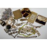 A collection of vintage costume jewellery to include a green paste set necklace, millifiori beads,