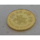 A Canadian 1993 one hundred dollar coin 58.33% gold, 41.67% silver, 13,378gms silver, 7.77gms gold