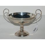 A silver twin handled comport, rubbed marks, 12cm high, weighted Condition Report: Available upon