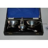 A cased three piece silver condiment set, Birmingham 1909 Condition Report: Available upon request