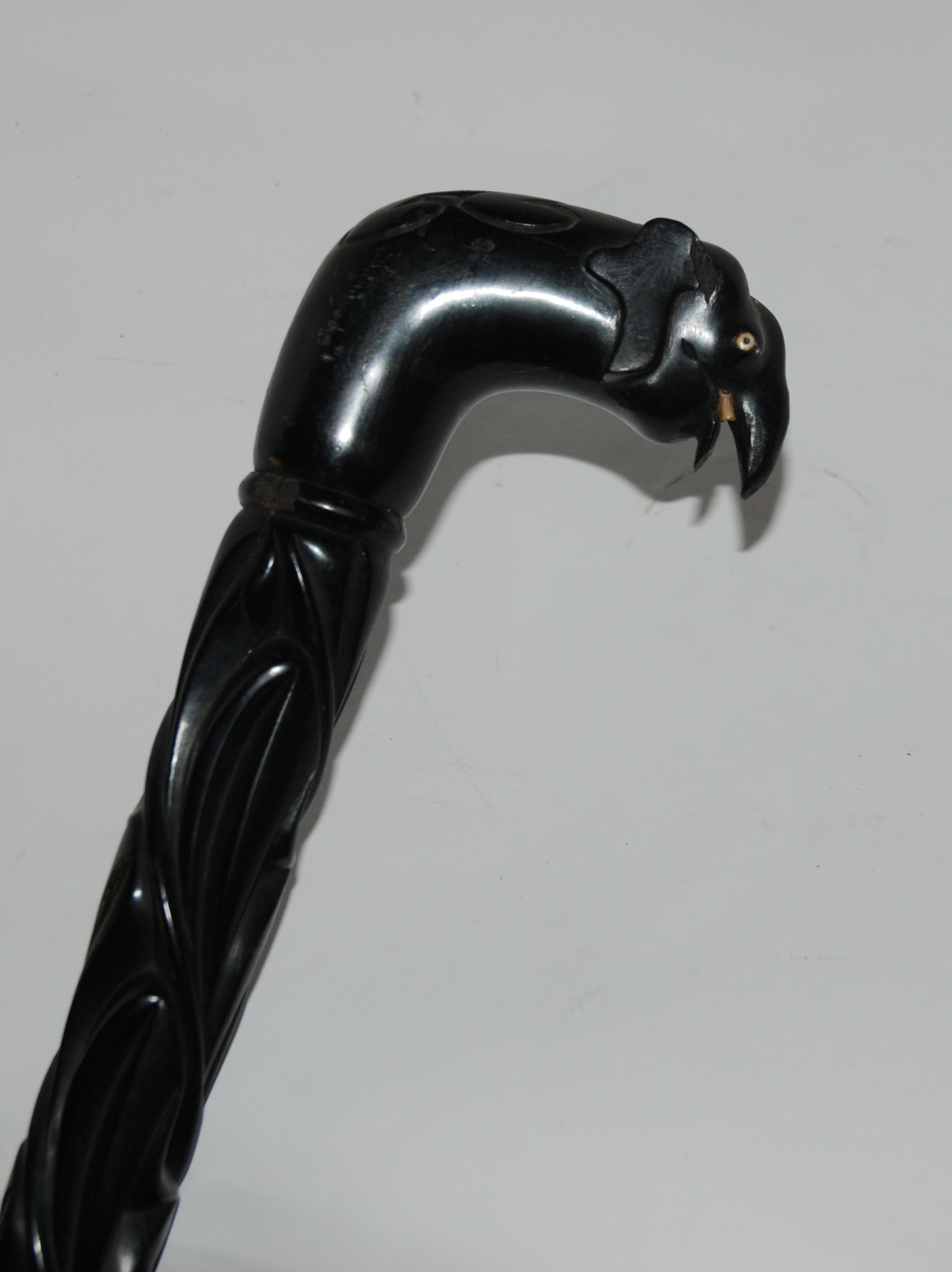 An ebony walking cane the handled modelled as an elephant, 90cm long (def) Condition Report: