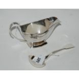 A lot comprising an Art Deco silver sauce boat, Birmingham 1930 and a sauce ladle, London 1825,