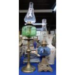 A brass oil lamp with green glass font and a smaller oil lamp with blue glass font Condition Report: