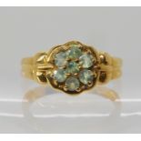 A 9ct gold alexandrite flower cluster ring, size N1/2, weight 3gms. With a GemsTV certificate
