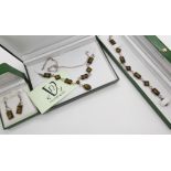 Silver mounted green amber bracelet, necklet and earrings Condition Report: Not available for this