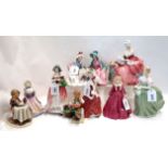 Four Royal Doulton figures including Afternoon Tea, Penelope, Clarissa, and Christmas Morn, together