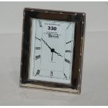 A silver mounted clock, Sheffield 1966, retailed by Harrods, 16.5cm x 12.8cm Condition Report: