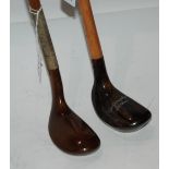 Two modern wooden head putters Condition Report: Available upon request