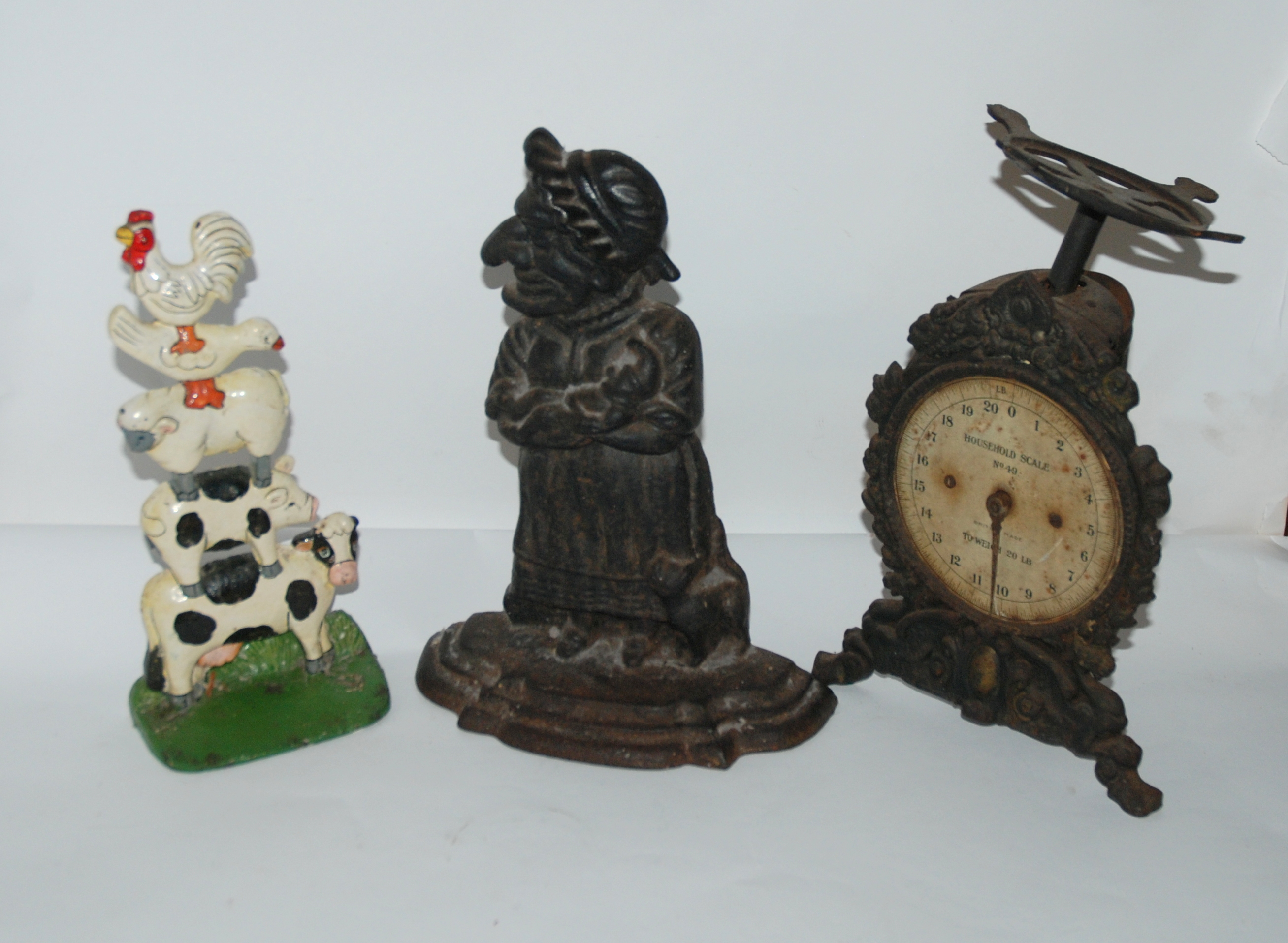 A cast Judy door stop, another painted door stop and vintage scale (def) Provenance - The Estate