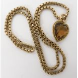 A bright yellow metal heart shaped citrine pendant, length 2.2cm and yellow metal box chain length