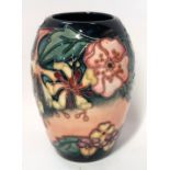 A Moorcroft Honeysuckle and Dog Rose pattern vase, 13cm high (boxed) Condition Report: Available