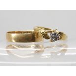 An 18ct gold illusion set diamond ring, size J1/2, and an 18ct gold wedding ring size O1/2, combined