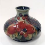 A Moorcroft Finches and Berries pattern vase, 11cm high Condition Report: Available upon request