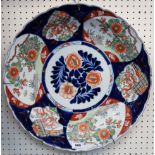 A large imari charger and a famille vert vase lamp base Condition Report: vase has been badly broken
