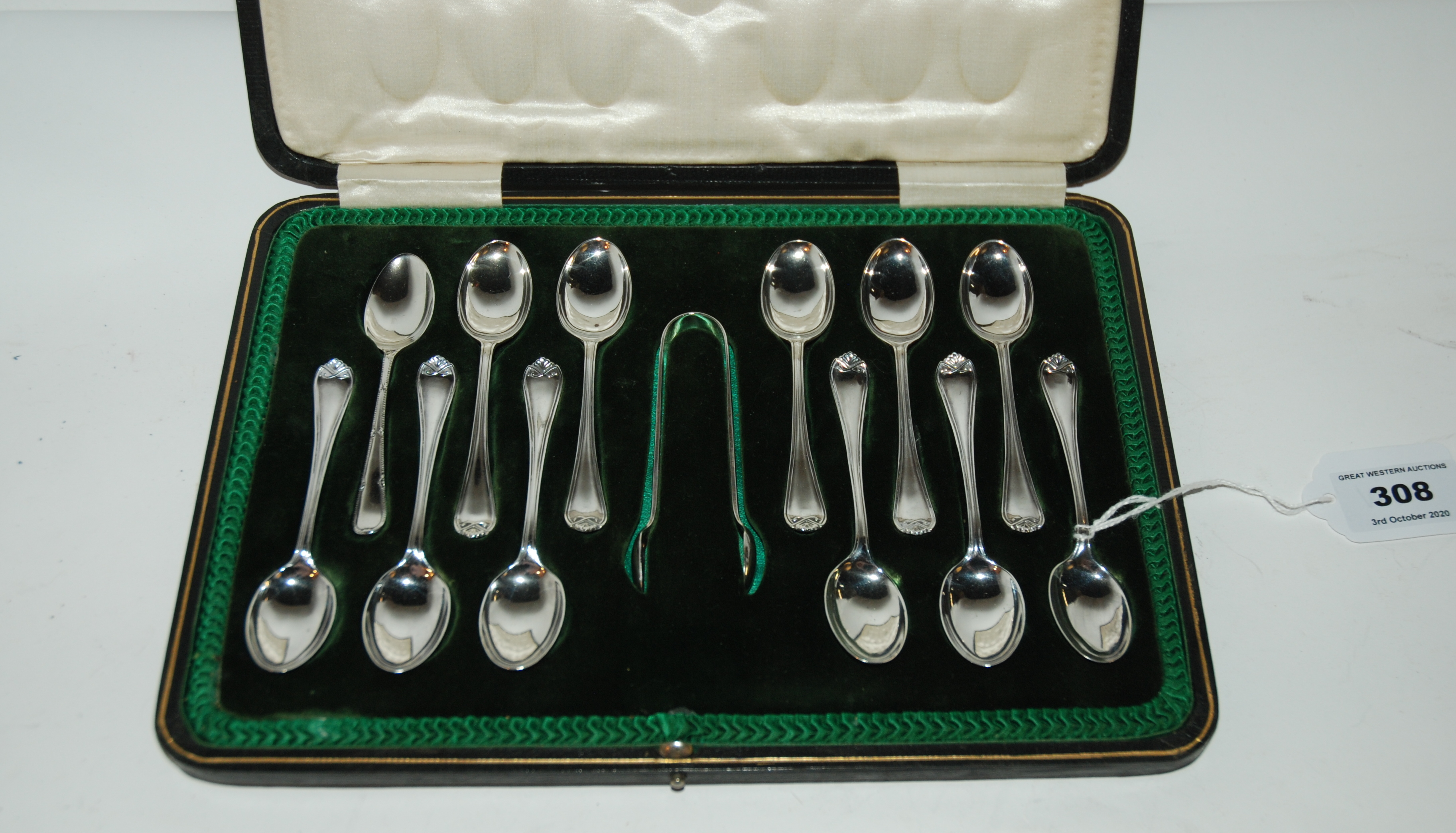 A cased set of twelve silver coffee spoons with tongs, Sheffield 1916 Condition Report: Available