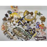 Vintage costume jewellery to include, enamel and button badges, 1st Nation woven bead necklace and