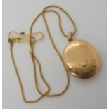 A yellow metal locket and chain weight 10.3gms Condition Report: Available upon request