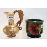 A blush ivory jug with dragon handle decorated with an owl and a Moorcroft Hibiscus pot Condition