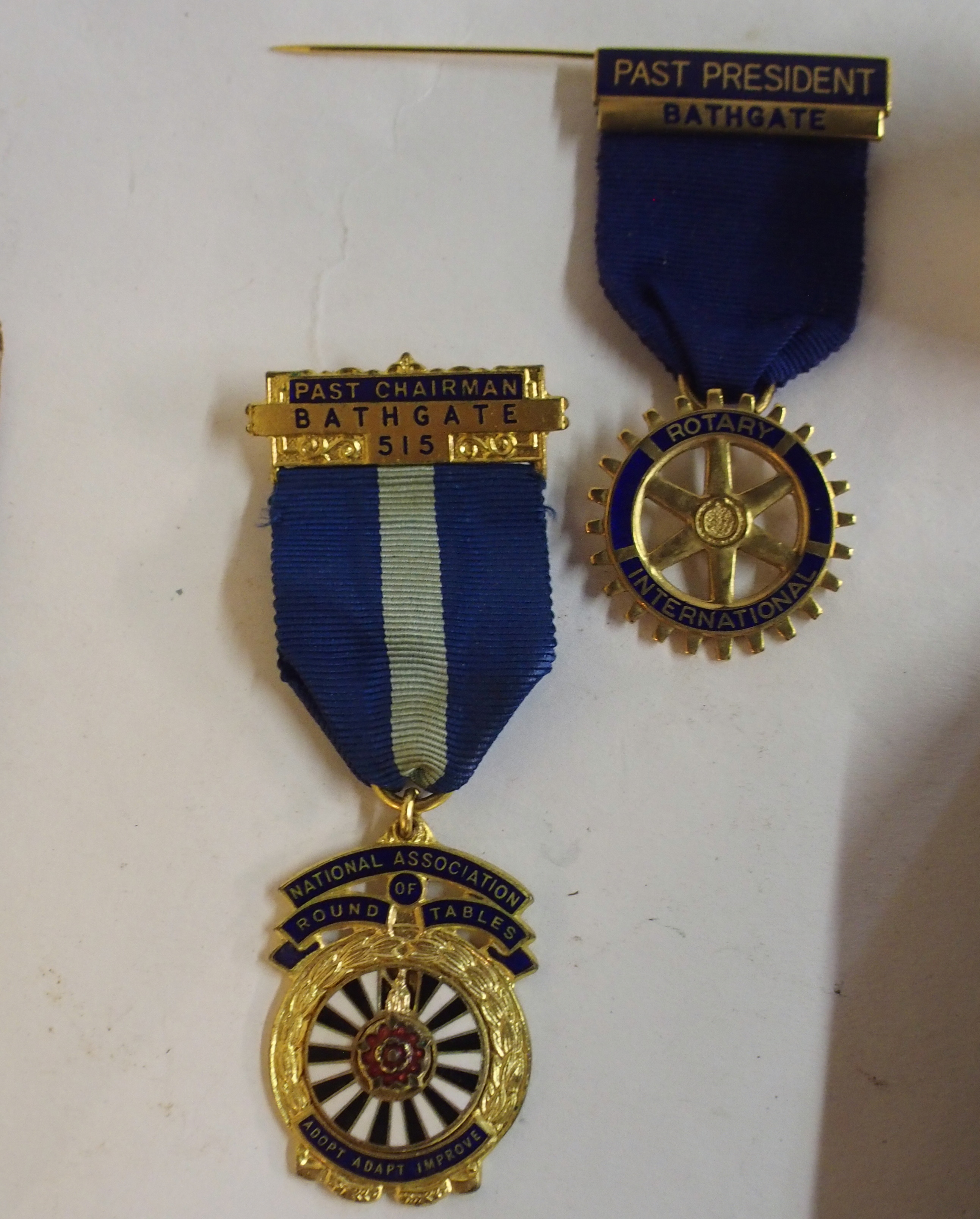 A yellow-metal and enamel Part President Rotary International lapel badge, similar Round Table