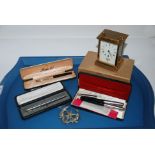 Four various vintage pens, Cyma carriage clock Condition Report: Available upon request