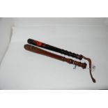 Two hardwood painted truncheons, 41cm and smaller (2) Condition Report: Available upon request