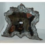 An Edwardian silver mounted easel mirror, London 1907 (very dirty with some losses), 47cm x 55cm