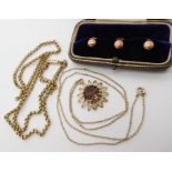 A 9ct gold boxed set of three shirt studs, a 9ct smoky quartz pendant and chain, and a 9ct vintage
