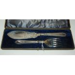 A cased pair of silver plated fish servers Condition Report: Available upon request