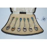 A cased set of six silver and floral enamel coffee spoons, Birmingham 1929 Condition Report: