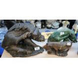 A large carved stone figure of a warthog scratching and two others Condition Report: Available