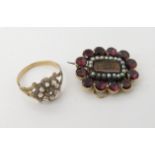A yellow metal garnet and pearl hair mourning brooch, together with a clear gem flower ring, size P,
