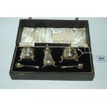 A cased three piece silver condiment set, Birmingham 1938 Condition Report: Available upon request