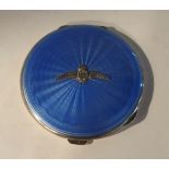 A silver and blue enamel compact with RAF badge, 7.8cm diameter Condition Report: Available upon