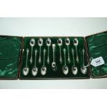 A cased set of twelve silver apostle coffee spoons with tongs, Sheffield 1895 Condition Report: