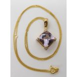 A 9ct yellow gold checkboard cut amethyst and diamond pendant length 2.8cm with a gold plated silver